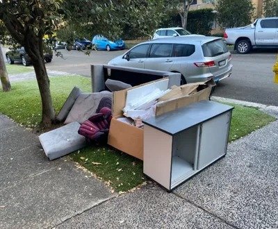 Old sectional couch being moved from property