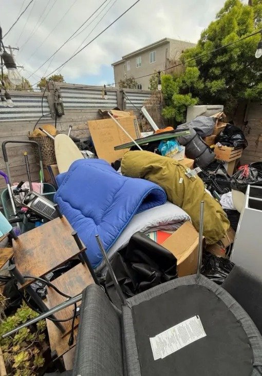Garage cleanup with unwanted items ready for pickup